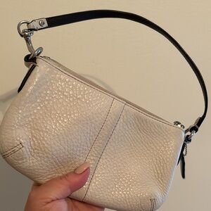 Coach leather wristlet in cream colour